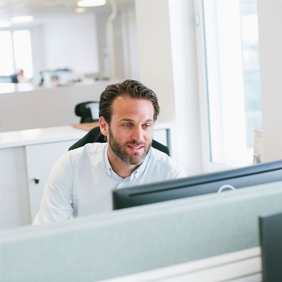 man infront of a computer