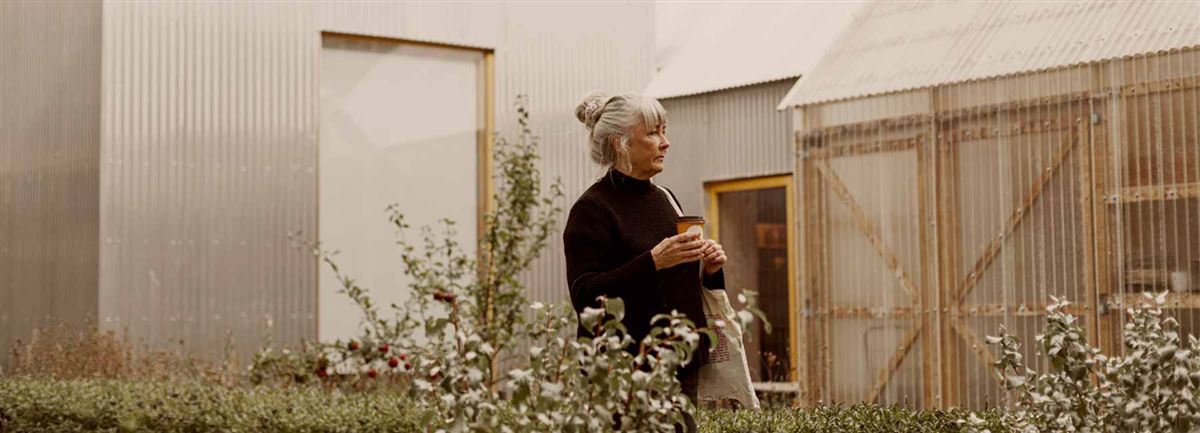 A woman in her garden. 