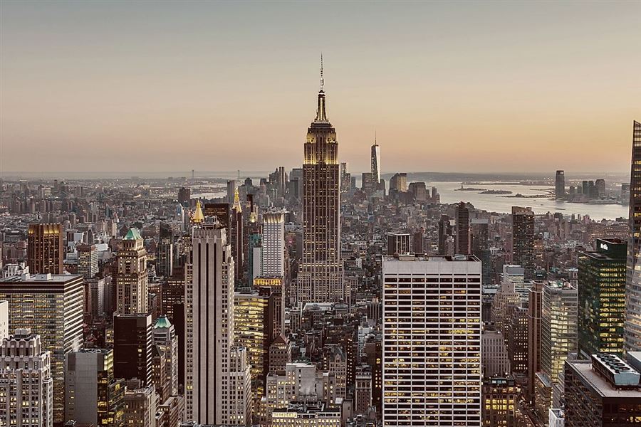 View of skyscrapers in New York City Manhattan downtown in sunset.