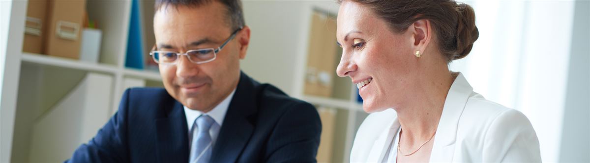 a man and a woman having a business meeting 